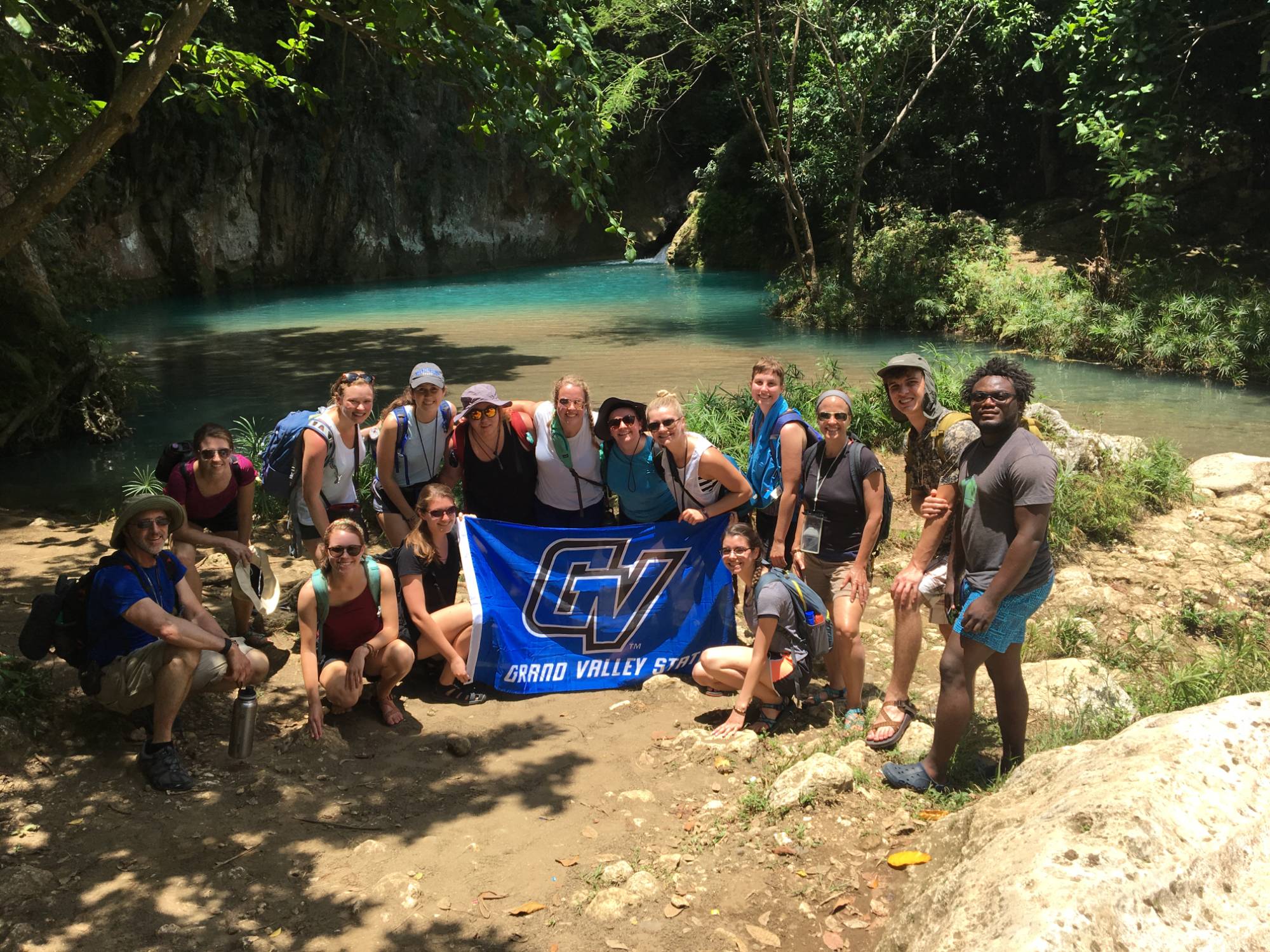 Honors students in Haiti with a GVSU flag